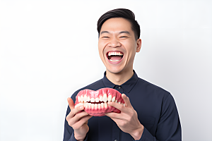 牙科广告人物假牙模型高清摄影图