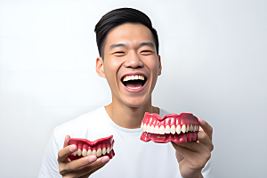 牙科广告人物假牙模型牙科诊所摄影图