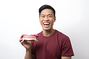 牙科广告人物口腔医院假牙模型摄影图