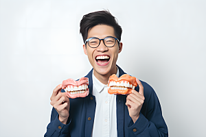牙科广告人物假牙模型口腔医院摄影图