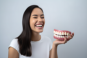 牙科广告人物高清假牙模型摄影图