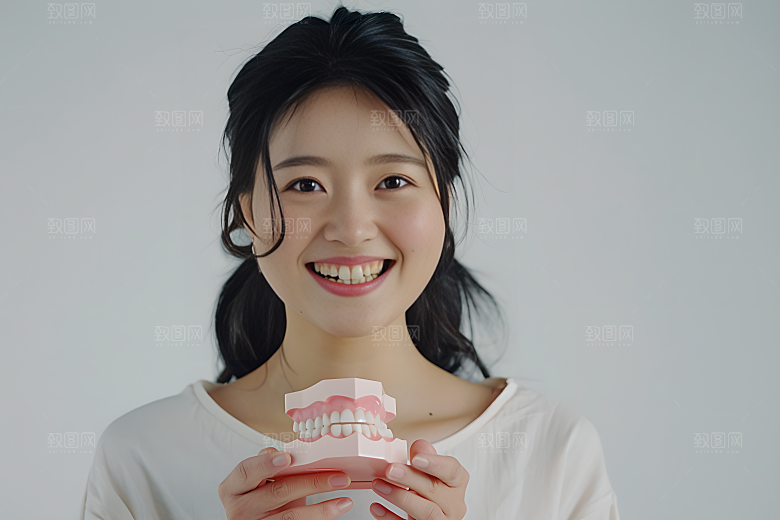 牙科广告人物口腔医院假牙模型摄影图