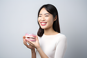 牙科广告人物假牙模型高清摄影图