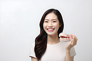 牙科广告人物假牙模型人物肖像摄影图