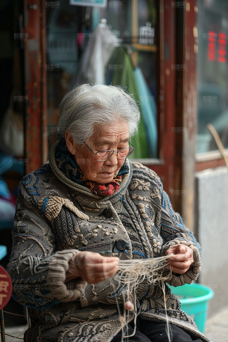 母亲织毛衣高清温暖摄影图